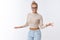 Sassy good-looking confident happy caucasian blond woman in cropped sweater glasses dancing joyfully waving hands and