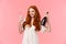 Sassy good-looking redhead woman celebrating with girlfriends, having fun together, holding bottle champagne and two