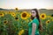 Sassy teenage girl in a field of sunflowers