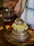 Satagopam in the shape of silver cap with  feet of Hindu god Vishnu,symbolically,and priest touch devotees head as blessing of