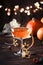 Satans whiskers, halloween cocktail with gin, vermouth, orange juice and liquor, vintage dark wooden background with festive decor