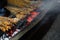 Satay goat or meat goat satay with charcoal ingredient on red fire grilling by people.per