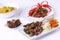 Satay oxtail Fish masala curry and stir fry mushrooms Indonesia food on white plate