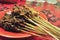 Satay is a typical Indonesian food made from meat skewered on a stick.