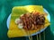 Sate indonesian skewer with a natural background. Sate is one of traditional Indonesian food which served with peanut sauce