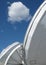 Satellite communication dishes under a blue sky