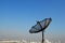Satellite Dish and Black Aerial Antenna on Rooftop