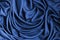 Satin fabric drape blue abstract background