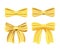 Satin golden bow, bright gold yellow ribbon.