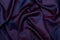 Satin lining fabric, close-up. Iridescent purple lilac material for sewing and patterns. Abstract background with folds. Design