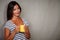 Satisfied brunette woman holding coffee cup