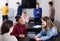 satisfied classmates having animated talks at break between classes