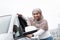 Satisfied cute islamic african american lady customer in hijab touching new car outdoor, enjoying buying