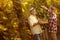 Satisfied family harvesting grapes in vineyard