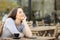 Satisfied girl breathing fresh air on a cafe terrace