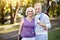 Satisfied likable aged couple after good physical training in park