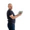 Satisfied man in jeans and a T-shirt with money, dollars in hand isolated on a white background. Profit, wealth, winning the