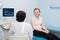 Satisfied pregnant woman having doctor`s appointment with ultrasound diagnostics