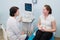 Satisfied pregnant woman having doctor`s appointment with ultrasound diagnostics