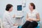 Satisfied pregnant woman having doctor`s appointment with ultrasound diagnostics