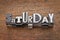 Saturday word in mixed vintage metal type