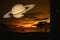 Saturn back on night cloud sunset sky silhouette boat on sea