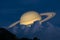 Saturn on night sky back silhouette mountain and heap cloud