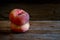 Saturn peaches on wooden table.