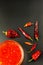 Sauce made of peppers. Preparation of spicy food. Healthy food. On a black background.