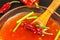 Sauce made of peppers. Preparation of spicy food. Healthy food. On a black background.