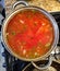 Saucepan with cooking borscht on kitchen stove