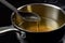 Saucepan and ladle with used cooking oil household. Generate Ai