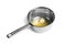 Saucepan with melting butter on white