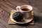 Saucer and Cup, Tamarind tea or Date Tea, dry ball from the seeds and resins of Indian tamarind on a table. Exotic drink