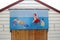 Saucy postcard beach hut painting