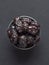 Saudi Ajwa Al-Madina dates are laid out on a black