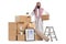 Saudi arab man with a pile of cardboard boxes packed for house removal