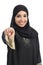 Saudi arab woman pointing at you and looking at camera