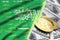 Saudi Arabia flag and cryptocurrency growing trend with two bitcoins on dollar bills