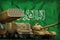 Saudi Arabia heavy military armored vehicles concept on the national flag background. 3d Illustration