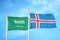 Saudi Arabia and Iceland two flags on flagpoles and blue cloudy sky