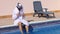 Saudi arabian man enjoying at swimming pool