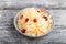 Sauerkraut, marinated cabbage on a gray wooden background. Side view, close up