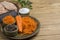 Sauerkraut on plate, grated raw carrots, parsley and salt