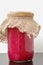 Sauerkraut and red beet in the glass on the wooden background