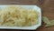 Sauerkraut in a white plate. Homemade sauerkraut. Fermented food. Natural probiotic