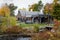 The Saugus Iron Works Forge and Slitting Mill surrounded by colorful fall foliage - landscape