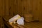 Sauna bench with white towels and bucket