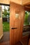 Sauna cabin with opened door with look to wellness area