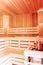 Sauna room. Wooden sauna interior with copper bucket. Bath accessories. Finnish sauna of small size.